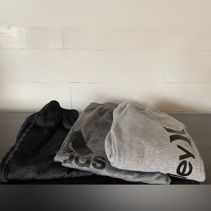 THREE pairs of sweats w/pockets size M10/12. Adidas;1 gray 1 black, Hurley grey